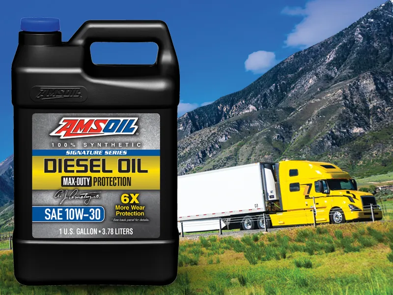 Semi and a bottle of AMSOIL SIGNATURE SERIES 10W-30 100% SYNTHETIC MAX-DUTY DIESEL OIL