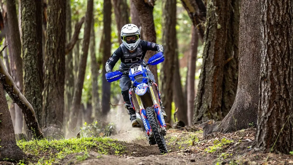 Dirt bike motorcycle riding in the woods
